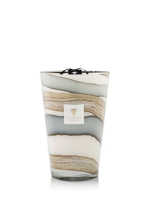 Large marbled patterned candle with a visible brand logo on a white background