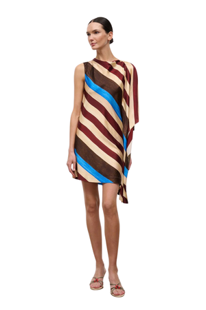 A model wearing a sleeveless, draped mini dress with diagonal stripes in brown, beige, and bright blue, set against a plain white background.