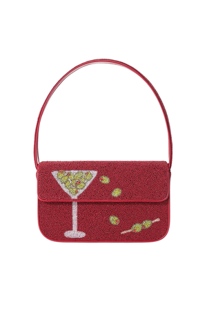 A red textured shoulder bag with a flap closure featuring a beaded martini glass and olive design, set against a plain white background.