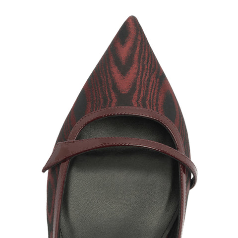 Red and black patterned slingback shoe on a white background