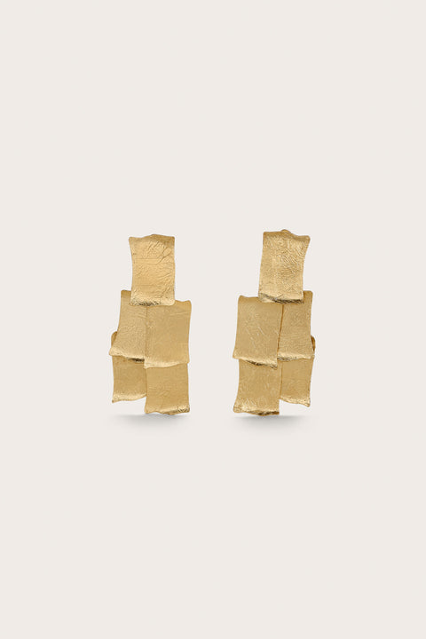 Gold-toned chandelier style statement earrings that feature five layered panels. 