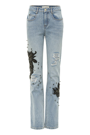 Blue denim slim leg jeans with black beaded appliques.