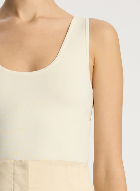 Up close of cleo cream tank top on model.