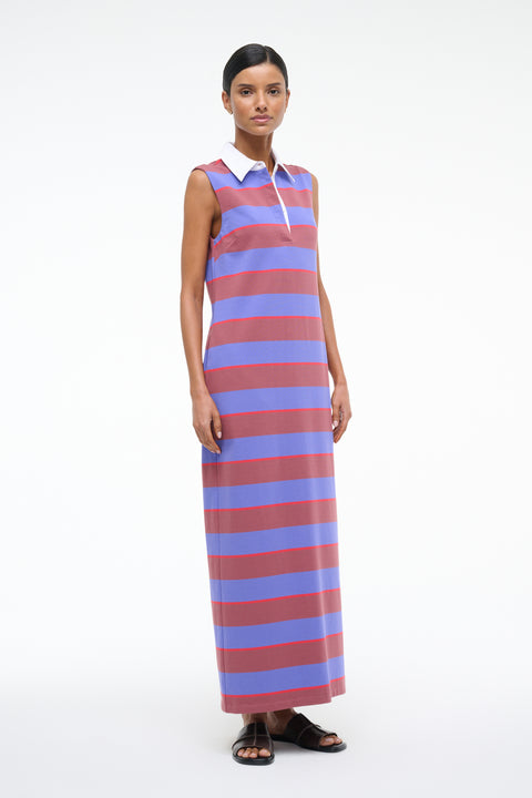 Woman wearing a sleeveless striped dress on a white background