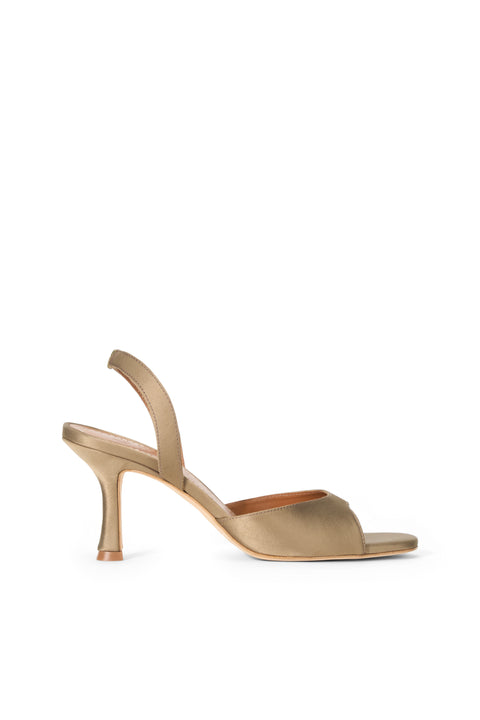 Gold high-heeled sandal on a white background