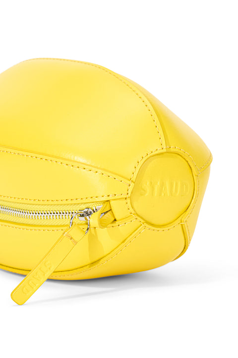 Yellow cosmetic bag with a visible brand logo on a white background