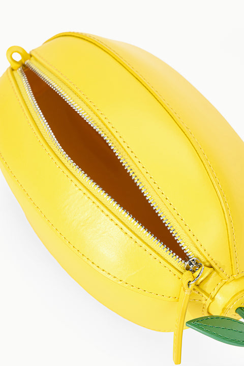 Yellow lemon-shaped bag with a zipper on a white background