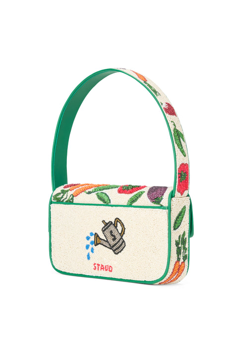 Small handbag with floral and leaf patterns on a white background
