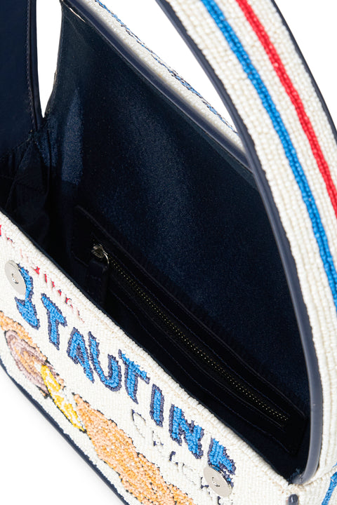 Beaded handbag with 'Original Stautine Crackers' design featuring crackers, oysters, and lemons with a navy blue lining. 