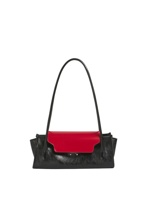 Elongated black leather shoulder bag with a red flap and silver toned hardware.  