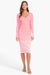 Model facing the camera in the pink ombre stripe midi dress with a matching cardigan