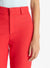 Close up of the red straight leg pants on a model