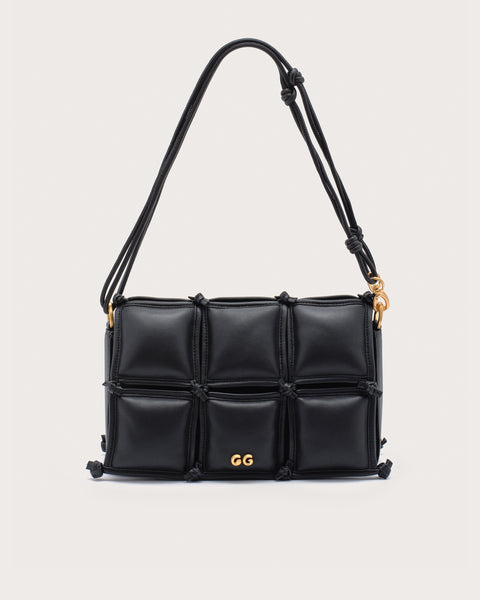 Black quilted handbag with gold accents and a shoulder strap. 