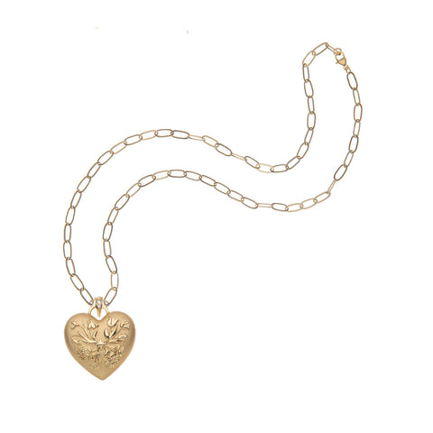 Gold heart pendant with flower design on gold paper clip style chain.