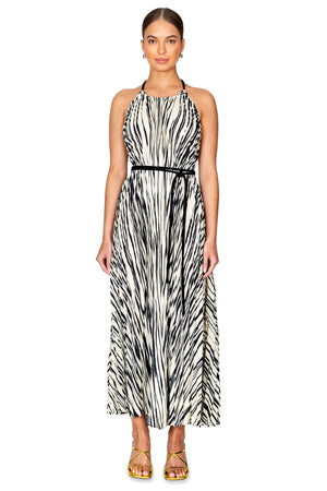 Model styled in the frida printed sheer pleated flou halter dress in black and white.