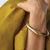Up close of model arm wearing the gia mega bangle.