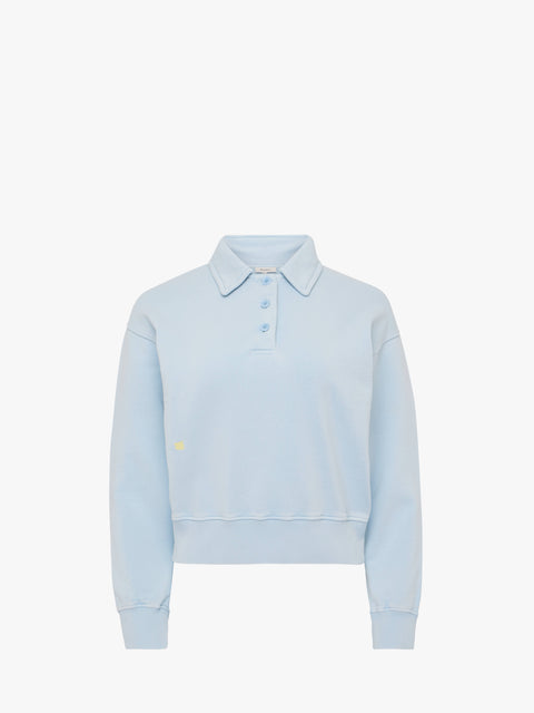 Light blue sweatshirt with a small logo on a white background