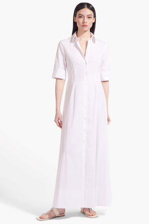 Full body view of a model facing the camera in the white cotton poplin maxi dress