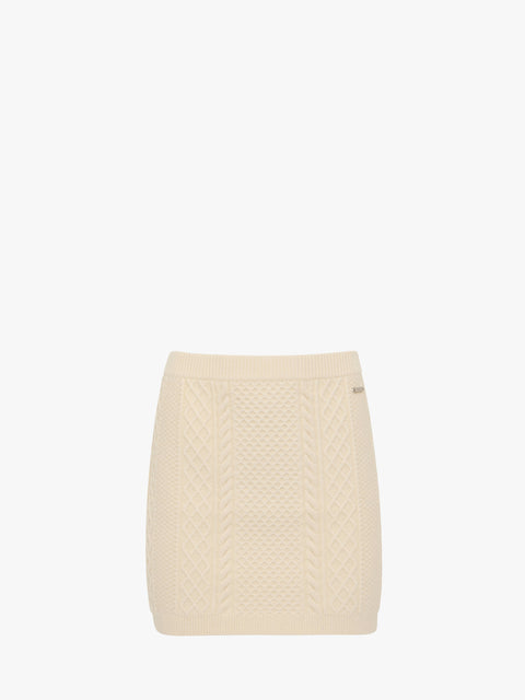 Cream knitted quilted mini skirt on a white background