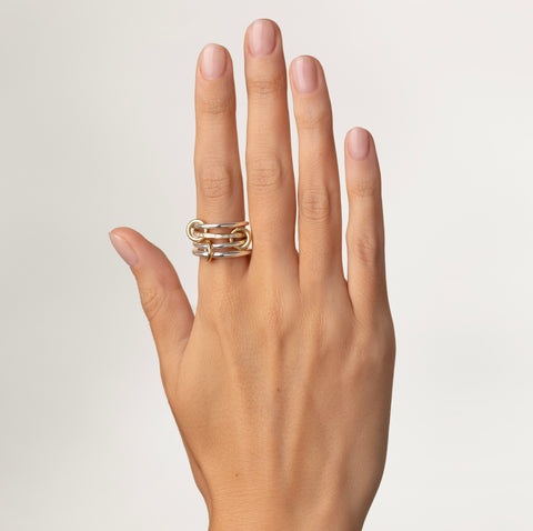 A woman wearing a Spinelli Kilcollin Kira SG ring. 