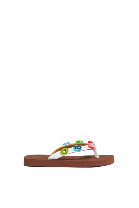 Brown rubber flip-flop sandal with white straps and colorful decorations on a light gray background