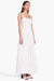 Model turned towards the right in the white sleeveless midi dress
