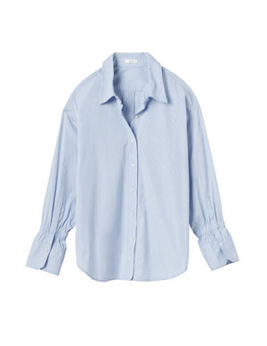 Ghost image of the monica long sleeve button up top in blue and white stripes.