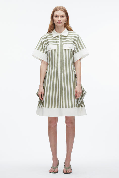 Woman wears green striped shirt dress with contrasting collar, sleeve and hem.