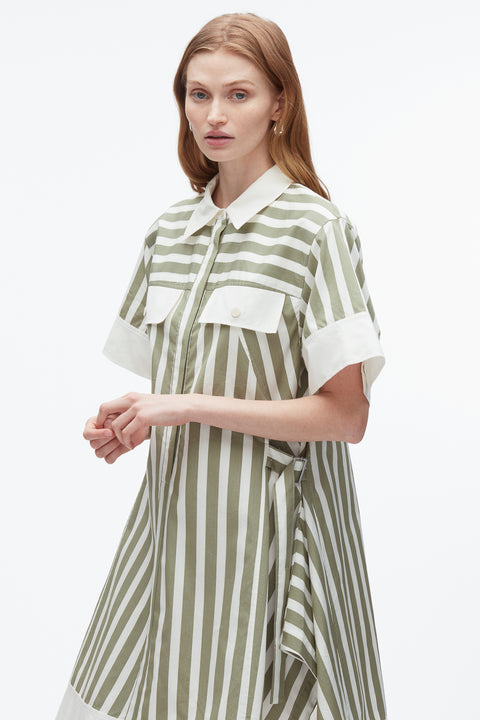 Up close of woman in striped shirt dress with front pockets at chest.
