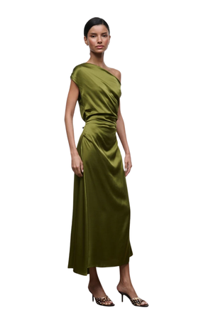 A woman modeling a one-shoulder olive green satin midi dress with a draped bodice and flowing skirt, paired with leopard-print high heels, against a plain white background.
