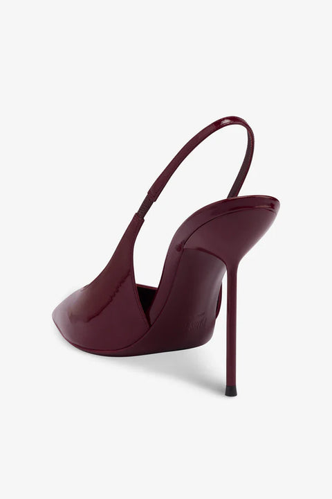 Back view of burgundy slingback high-heeled shoe on a white background