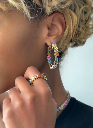 Up close of model wearing the catena autumn hoop earrings.