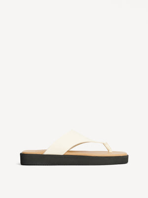 Ghost image of the side of the cream leather marisol sandal.