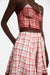Close up of the red and white plaid skirt on a model