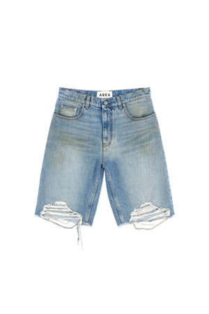 Blue denim shorts with distressed details on a white background