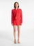 Model facing the camera in the red cropped blazer with a matching mini skirt