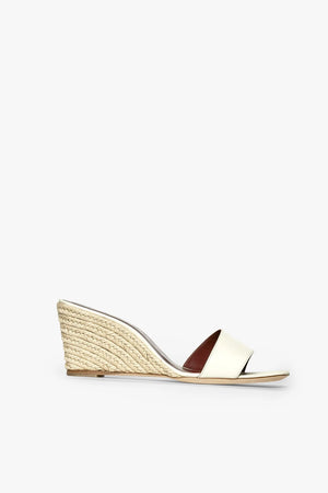 side view of the cream leather espadrille wedge 