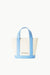 Ghost image of the other side of the allora mini tote in cream with staud logo in silver.