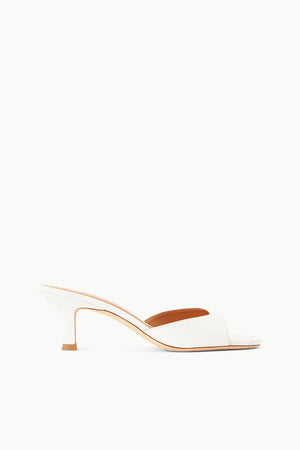 Side view of the white leather brigitte mule.