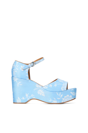 Right facing light blue wedge heel with white floral print