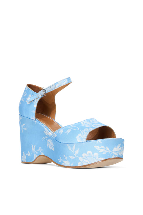 Right forward facing light blue wedge heel with white floral print