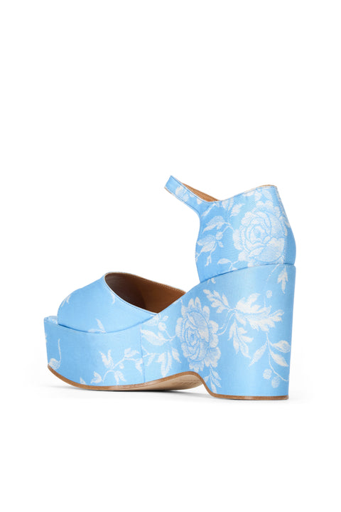 Back view of light blue wedge heel with white floral print