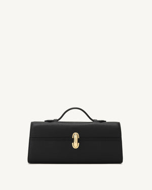Black skinny top handle handbag with a gold clasp on a white background