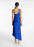 Model facing the back in the blue asymmetric midi dress