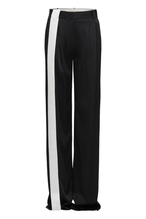 Black pleated front pant with white contrast ribbon in stretch satin crepe.