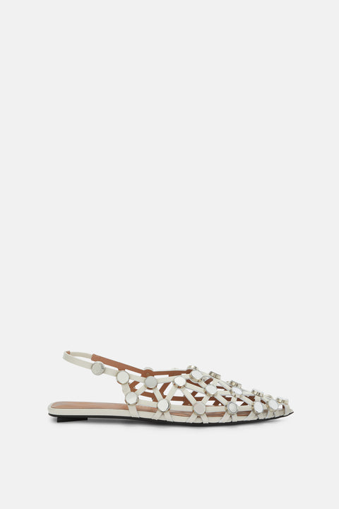 Side profile of a white leather slingback flat that features an intricate open grid design adorned with small, round mirror details. 
