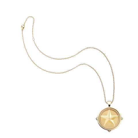 Gold necklace with a star pendant on a white background