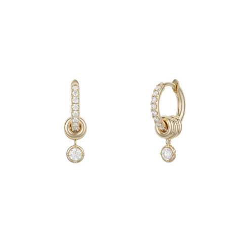 Ghost image of 18k yellow gold mini hoop earring that is pave with white diamonds and features three 18k gold annulets, one with a dangling white diamond charm. 