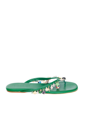 Green flip flop sandal with embellishments on a white background