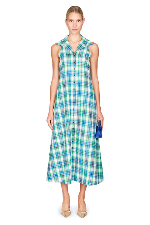 Woman wearing a blue and green plaid dress on a white background